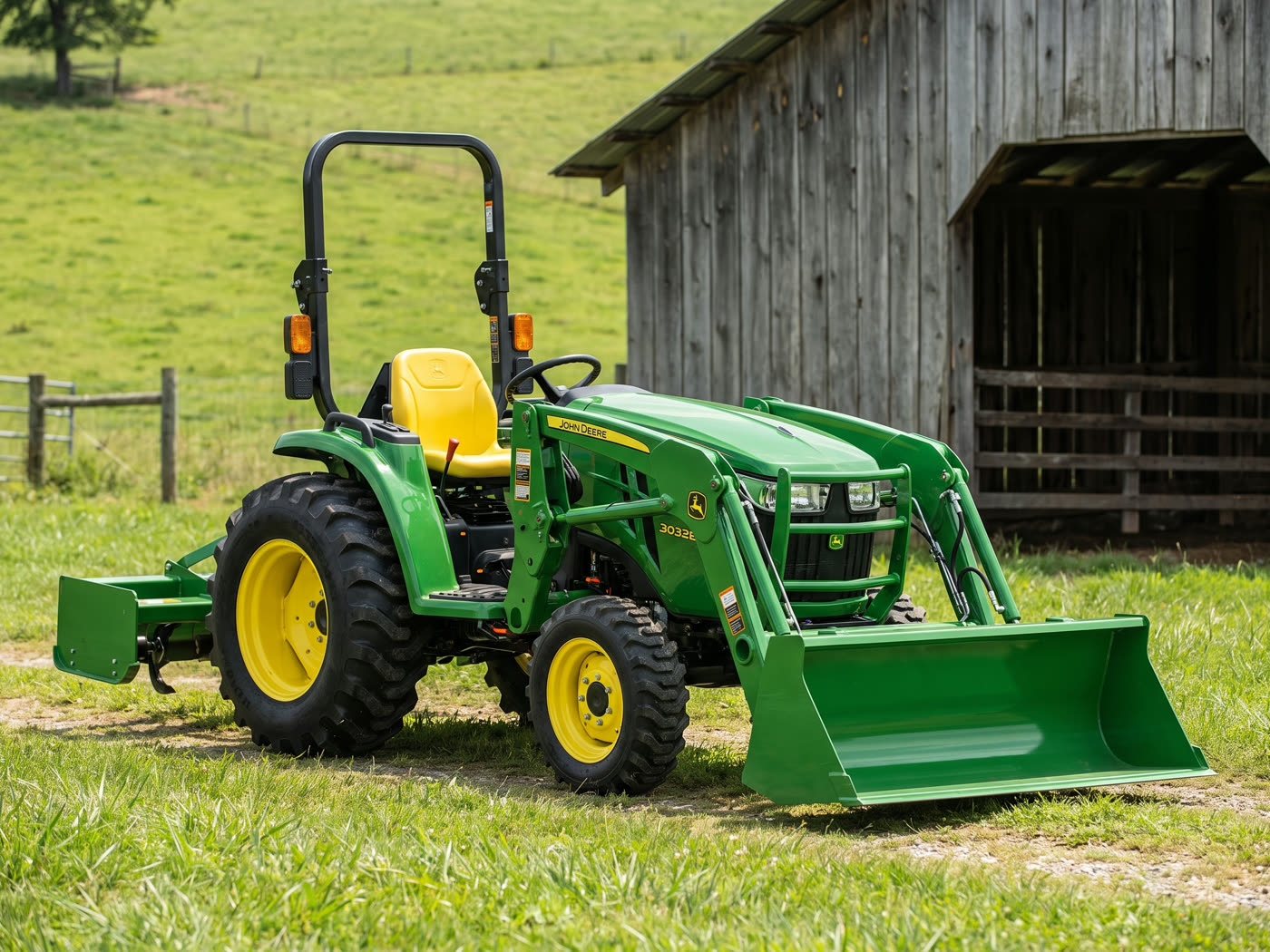 Small green compact utility tractor with front loader parked on a rural property
